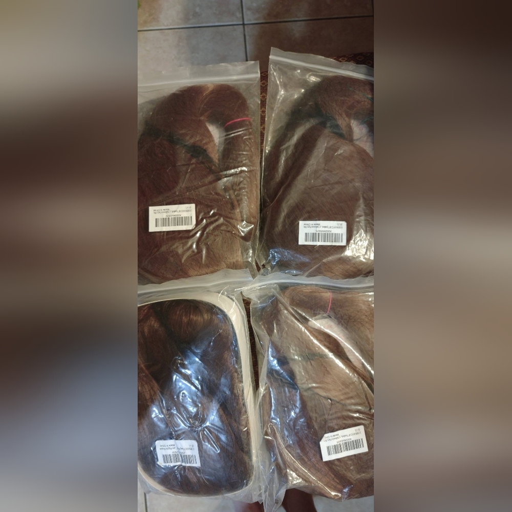 Lot of 4 wigs, eyelash kits, mini rubber bands, and bonnet.